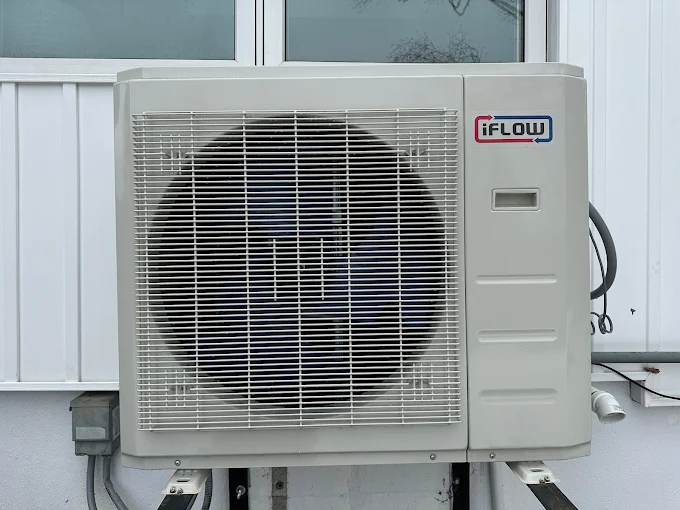 HVAC technician inspecting and diagnosing air conditioning system issues to identify cooling problems